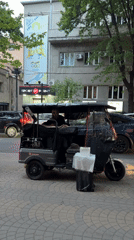 Everyday street scenes documented in Yerevan: tuk-tuk, street art