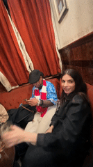 Woman takes mirror selfie in vine-decorated London location