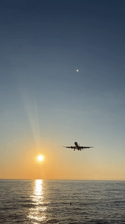 Sunset over Batumi: planes, coastline, and mountain views