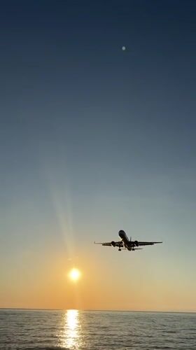 Sunset over Batumi: planes, coastline, and mountain views