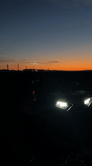 Vehicle spotted at dusk in Bulgarian countryside field