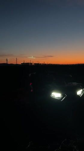 Vehicle spotted at dusk in Bulgarian countryside field