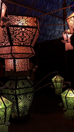 Decorative lanterns with geometric patterns displayed indoors in Matara