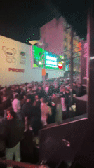 Young adults gather in crowds on Malta street at night