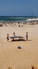 Tel Aviv beachgoers enjoy casual Friday morning activities
