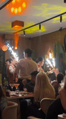 Moscow restaurant staff deliver sparkler dessert to celebrating diners