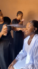 Woman receives beauty preparation for special occasion in Nigeria