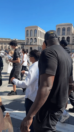 Tourist documents afternoon visit to Milan's Duomo and Galleria
