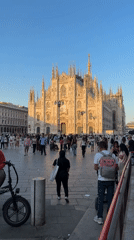 Busy afternoon scenes documented around Milan's Duomo square