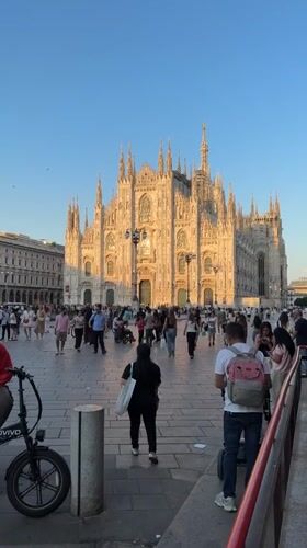 Busy afternoon scenes documented around Milan's Duomo square