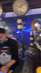 Novosibirsk nightclub party features mirrored dancer, DJ performance