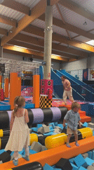 Man practices gymnastics at indoor trampoline park in Spain