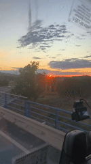 Sunset highway view captured from moving vehicle near Museros