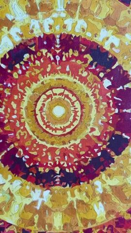 The camera pans out from a close-up of a partially completed paint-by-numbers image to show a larger view. The painting is done in a radial, spiral pattern with concentric circles of yellow, orange, red, and maroon. The painting is still in progress, with visible numbered areas yet to be colored.