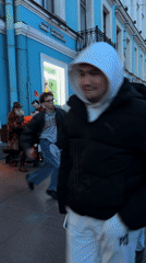 Evening street life documented across Saint Petersburg city center