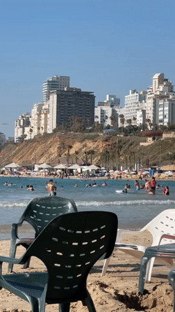 Busy summer afternoon on Netanya's Mediterranean beach