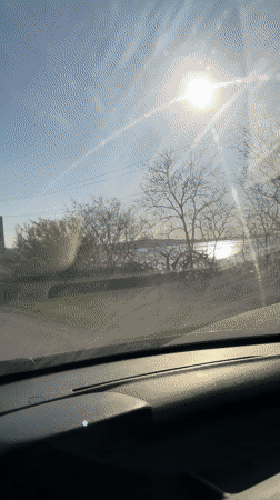 Driver travels sunny road in Burgas, Bulgaria