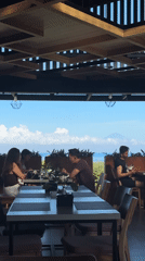 Early morning dining at Indonesian oceanfront restaurant terrace