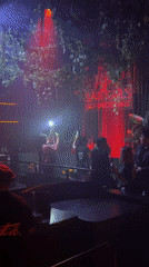 Neon-lit Patong club night with DJ and moody red ambiance