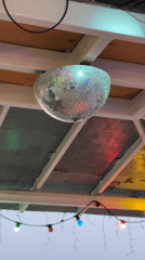 Evening beach dining scene with disco ball captured in Varna