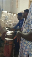 Community gathering at a covered venue in Kakuri Gwari