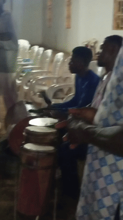 Community gathering at a covered venue in Kakuri Gwari