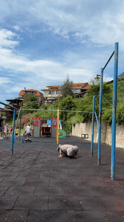 Man exercises at seaside playground in Nesebar, Bulgaria
