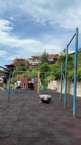 Man exercises at seaside playground in Nesebar, Bulgaria