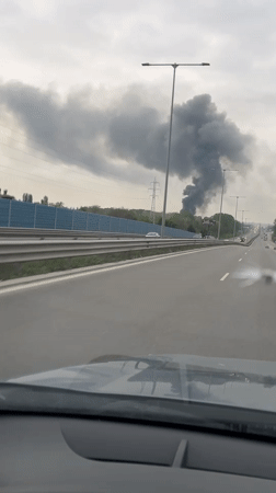 Dark smoke column spotted from highway during morning commute