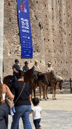 Morning at Sforza Castle: mounted police, tourists, and architecture