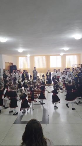 Children perform traditional folk dance in Bulgarian village