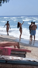 Lazy morning at a tropical Indonesian beach: swimming, paddleboarding, lounging.