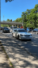 Regular traffic flows through Sofia intersection on sunny afternoon