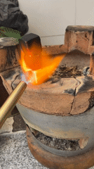 Early morning charcoal cooking and fish meal in Vietnam