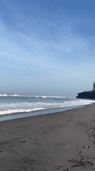 Beach activities documented at black sand coast in Kediri