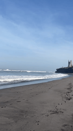 Beach activities documented at black sand coast in Kediri