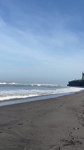 Beach activities documented at black sand coast in Kediri
