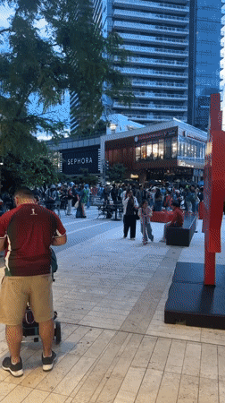Outdoor soccer watch party draws flag-waving crowd in Burnaby plaza