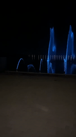 Illuminated fountain display lights up a Petropavl night