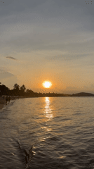 Golden hour on a Ko Samui beach with jet ski action
