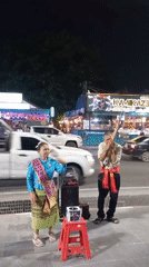 Night scenes documented in Pattaya: street performers, palm trees