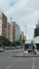 Argentine flag-carrying group marches through downtown Córdoba streets