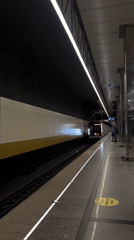 Moscow Metro Train Arrives at Station During Morning Hours