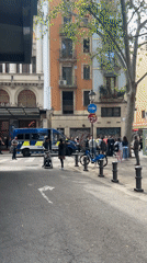 Morning street life and public gathering captured in Barcelona