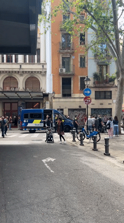 Morning street life and public gathering captured in Barcelona