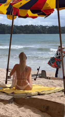 Relaxed beach afternoon with a colorful umbrella and ocean views