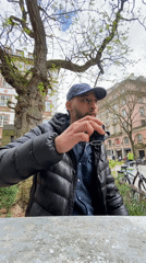 Man enjoys afternoon coffee at Strasbourg outdoor cafe