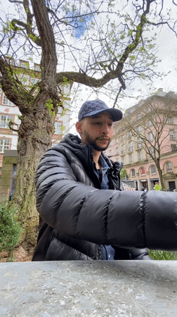 Man enjoys afternoon coffee at Strasbourg outdoor cafe