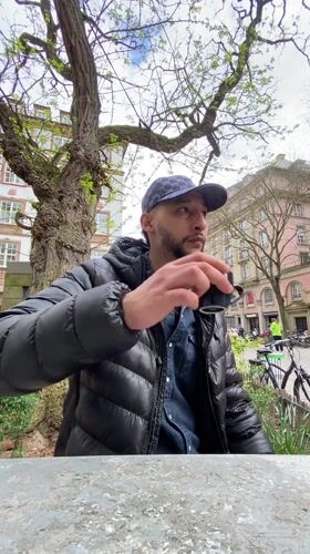 Man enjoys afternoon coffee at Strasbourg outdoor cafe