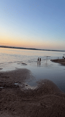 Evening life captured along Samara's Volga waterfront during sunset